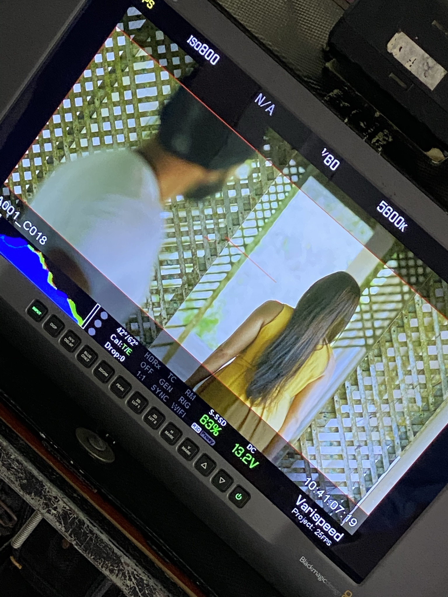 Production monitor showing a framed scene from the visual